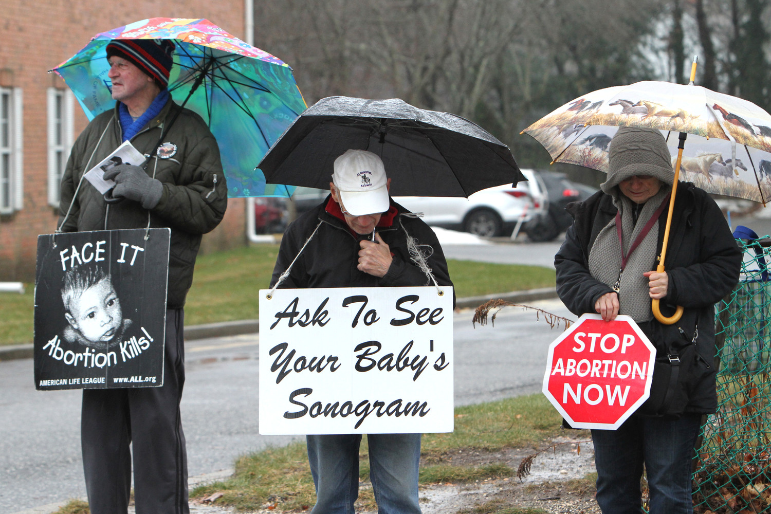 Pro-life advocates gather in silent witness near the entrance of a Planned Parenthood center in 2018 in Smithtown, N.Y. A proposed abortion law for New York state that would allow more health practitioners to provide abortion and remove all state restrictions on late-term abortions “is not progress” as lawmakers argue, said New York’s Catholic bishops.